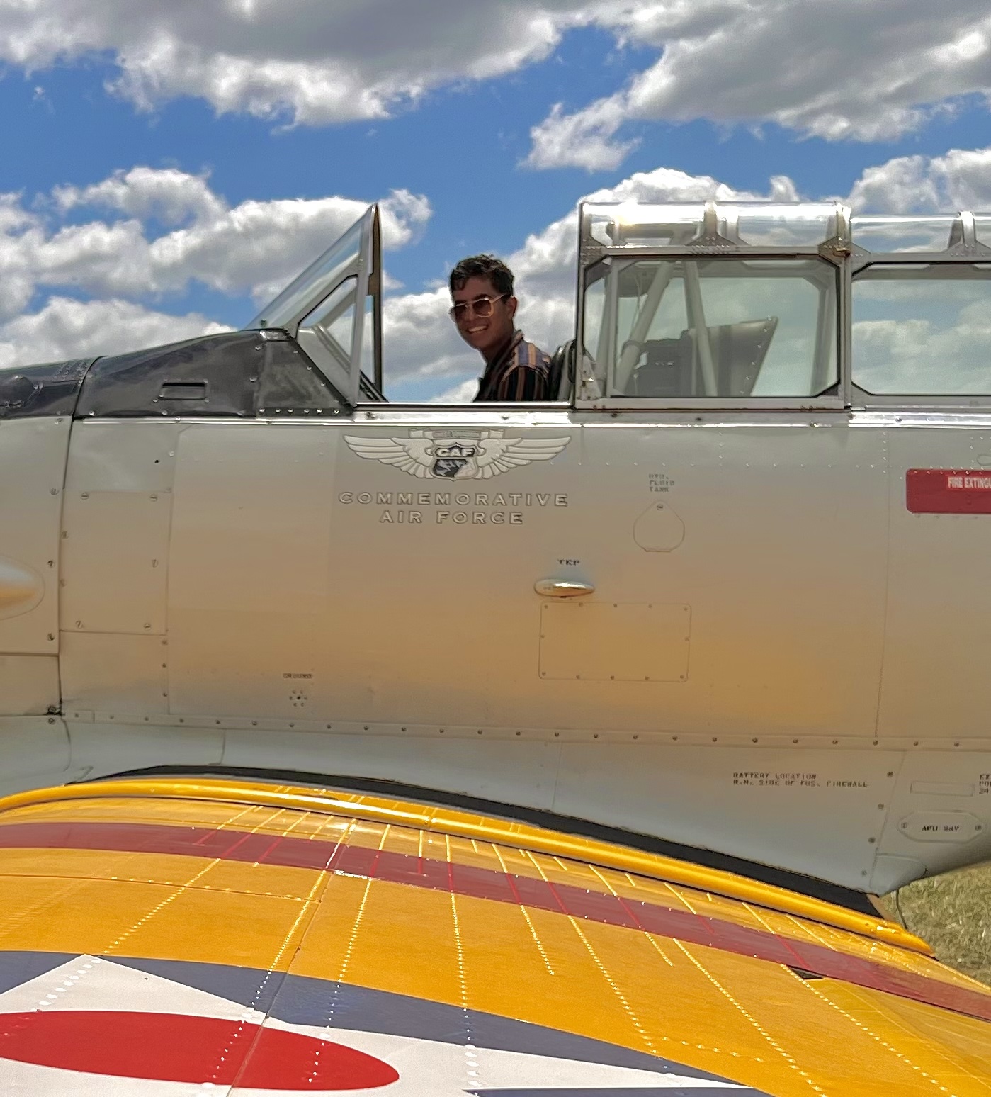 Dhruv posing for a photo in the front seat of Gary's T-6 Texan. Despite his best attempts, he was relegated to the back for the actual flight.